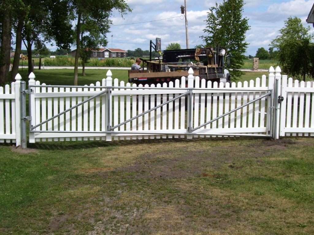 PVC picket fence façade on galvanized steel frame with galvanized steel post. LARGE gates available! 